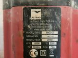 an image of a red machine with a label on it