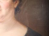 portrait of a woman in a black dress with a red bow