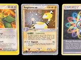 three pokemon cards with different designs on them on a black background