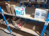 many boxes and packages on the shelves in the warehouse