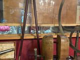 a display of old tools on display in a glass case