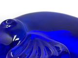 a blue glass elephant with a tag on it