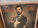 a box full of cds with a picture of a man in a tuxedo