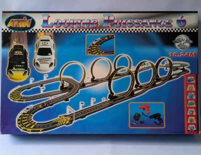 a box with a toy train set in it