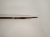 a knife that is laying on a white surface