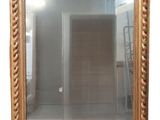 a mirror hanging on the wall in a room