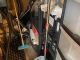 a mop and a bucket in a garage