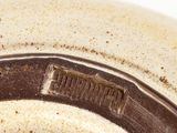 a close up of a brown and white bowl