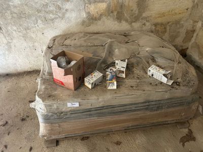 a box of cigarettes sitting on top of a mattress