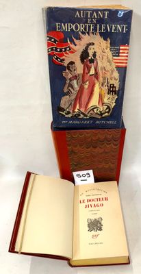 an open book sitting on top of a table next to an open book