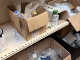 many boxes that are sitting on a shelf in a room