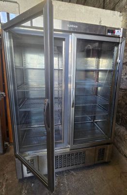 two glass doors that are open in a room