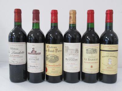 several bottles of wine are lined up on a table