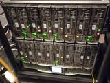 a rack of servers in the middle of a server room