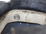 a close up of a person holding a pair of shoes