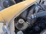 a close up of a car ' s engine with the hood open