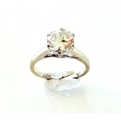 an image of a diamond ring on a white surface