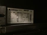 a train ticket sitting on a rail in the dark