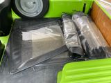 two umbrellas in the back of a green truck