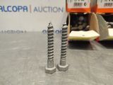two screws that are sitting on a table