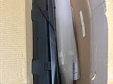 a cardboard box with two different types of electronic devices inside of it