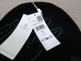 a black hat with a white tag on it