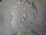 a close up of a sculpture of a woman ' s head