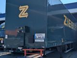 a semi truck that is parked in a parking lot