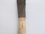 a large knife that has been carved into a piece of wood