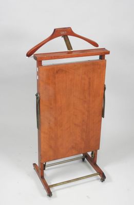 an image of a wooden clothes rack with a hanger on it