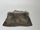 an antique silver mesh purse with a chain handle