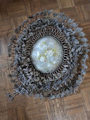 a picture of a bowl of flowers on a wooden floor