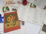 a lot of cards and postcards on the table