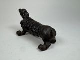 antique cast iron figurine of a dog on a white background