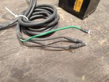 a black box with a green wire and a black box with a green wire