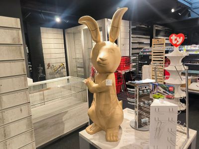 a statue of a rabbit that is on display in a store