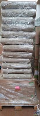 a stack of boxes and a pallet full of mattresses