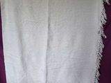 an image of a white towel hanging on a purple wall