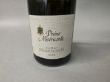 a bottle of wine that is sitting on a table