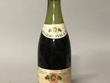 a bottle of wine that is sitting on a table