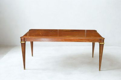 an image of a wooden table with a glass top on a white surface