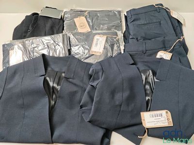 a pile of men ' s clothing sitting on a table