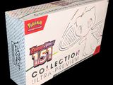 the box contains a pokemon trading card and a pokemon trading card