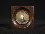 an old picture of a man in a suit and tie in a wooden frame