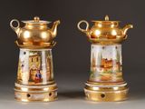 pair of gold - plated vases with painted scenes on them