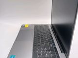 a laptop computer sitting on top of a white table