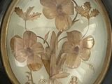 a picture of a decorative plate with flowers on it