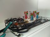 a lot of dog leashes on the counter in the bathroom