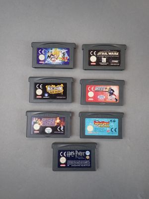 a lot of nintendo game cartridges on the table