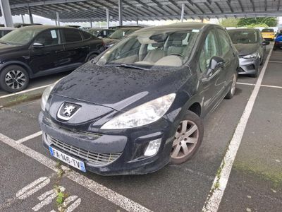 a black car that is parked in a parking lot